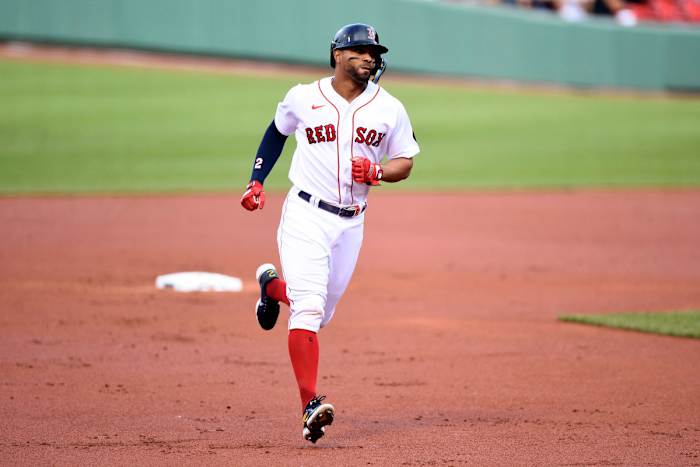 Red Sox shortstop Xander Bogaerts runs the bases after hitting a solo home run against the Astros.